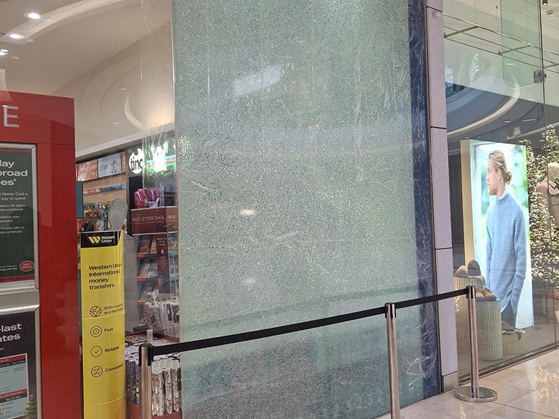 Emergency commercial glazing repair to a shattered glass panel within a retail environment