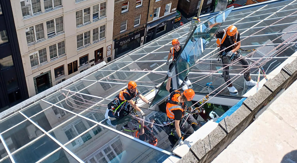 High level glass replacement carried out at height on a commercial glazed roof structure